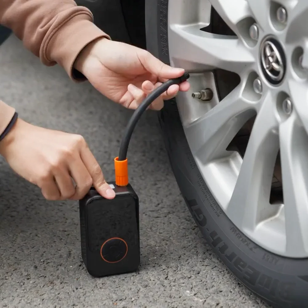 Auto Air connected to a car tire, showing the pressure on its display